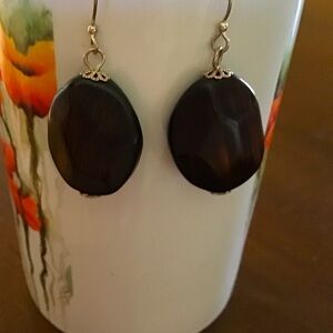 1.5” Drop wooden-look Earrings with silver tone trim.